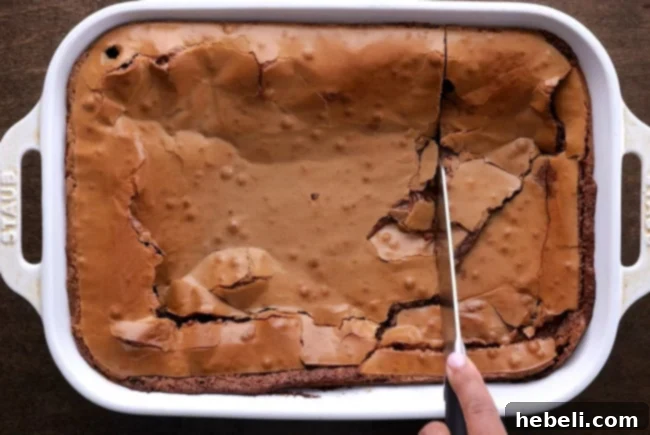 Slices of Nutella Gooey Butter Cake arranged on a cutting board, ready to be served.