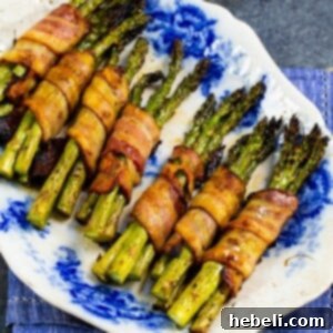 Bacon Wrapped Asparagus Bundles close-up, showcasing the crispy bacon texture and glistening glaze.
