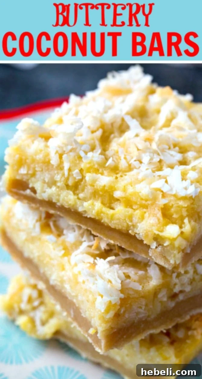 Decadent Coconut Squares 4 Stacked Buttery Coconut Bars on a cooling rack, showcasing the golden shortbread crust and moist coconut filling, ready for storage or serving.