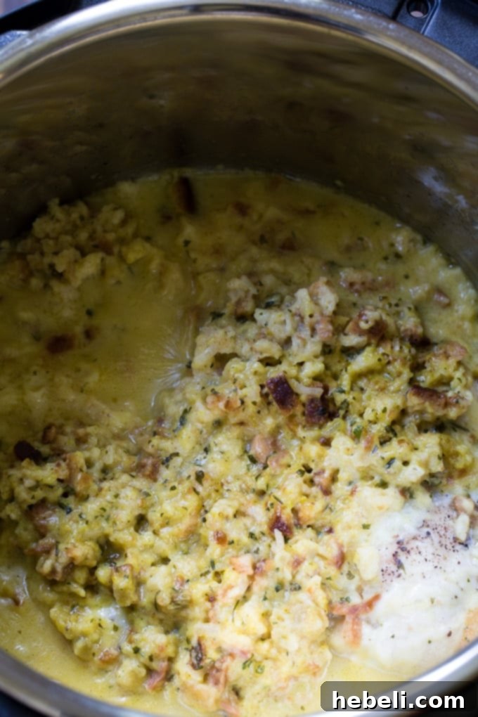 Swiss Bliss Instant Pot Chicken 5 A plated meal of Instant Pot Swiss Chicken (chicken and stuffing casserole with swiss cheese) served with a side dish.