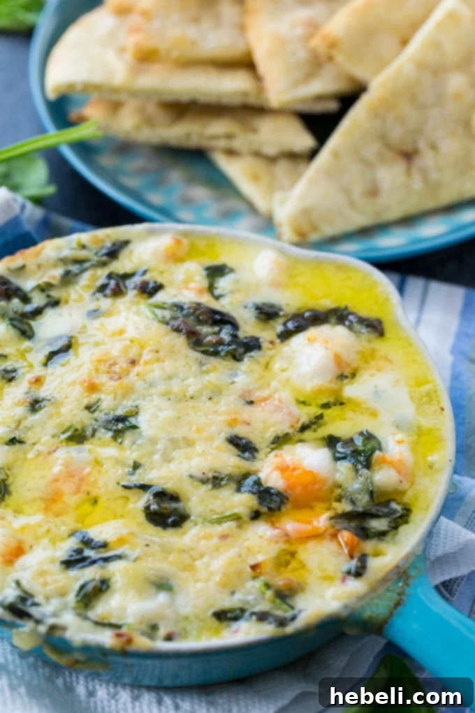 Decadent Cheesy Shrimp and Spinach Dip 3 Cheesy Shrimp and Spinach Dip served with crunchy pita chips
