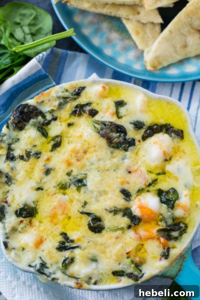 Decadent Cheesy Shrimp and Spinach Dip 4 Cheesy Shrimp and Spinach Dip, a close-up of the bubbly, baked dip
