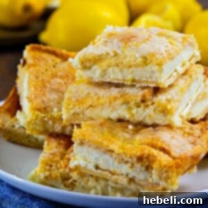 A perfectly baked Lemon Cream Cheese Bar, showcasing its layers of golden crust and creamy filling.