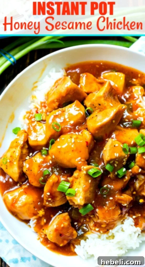 A final close-up shot of the Instant Pot Honey Sesame Chicken, garnished with an abundance of sesame seeds and sliced green onions, served beautifully over a bed of white rice in a bowl.