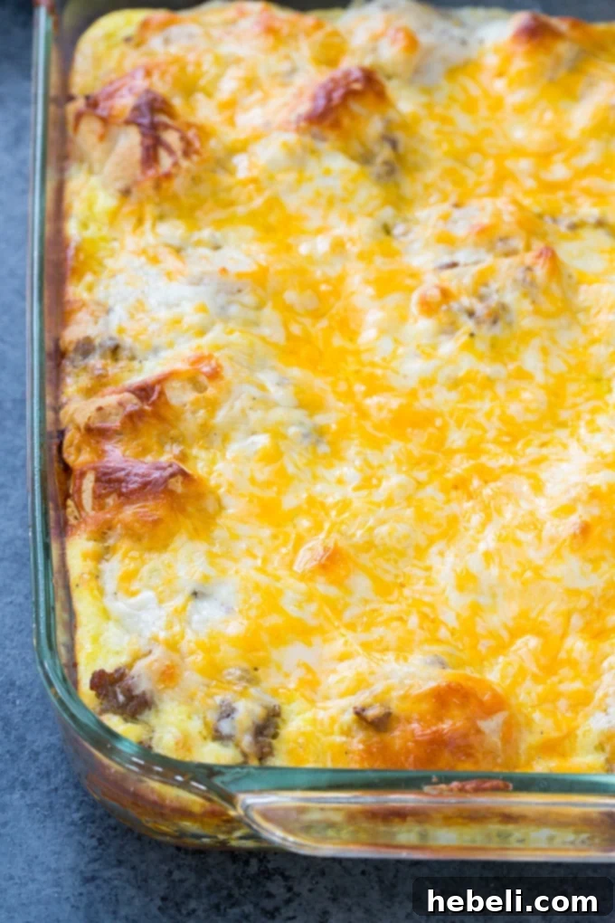 Close-up of the delicious Biscuits and Gravy Casserole, showcasing its golden-brown topping and rich, creamy interior.