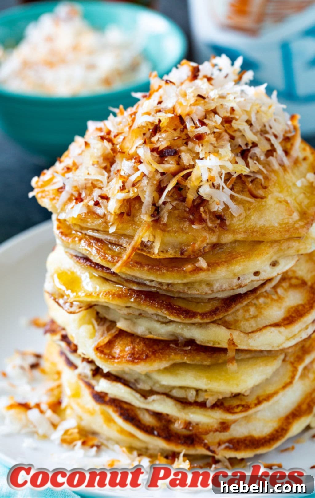 Tropical Coconut Pancakes 4 Stack of Coconut Pancakes on a plate.