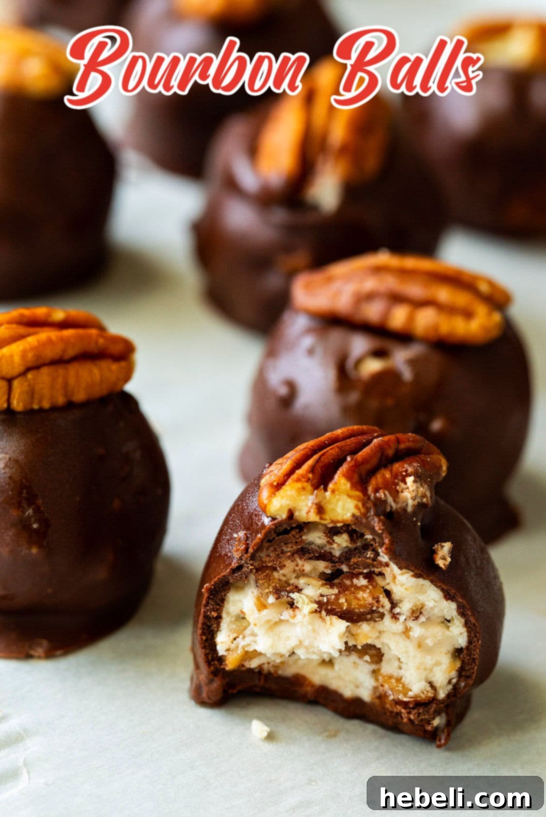 Bite taken out of a Bourbon Ball, showing the rich, dense filling.