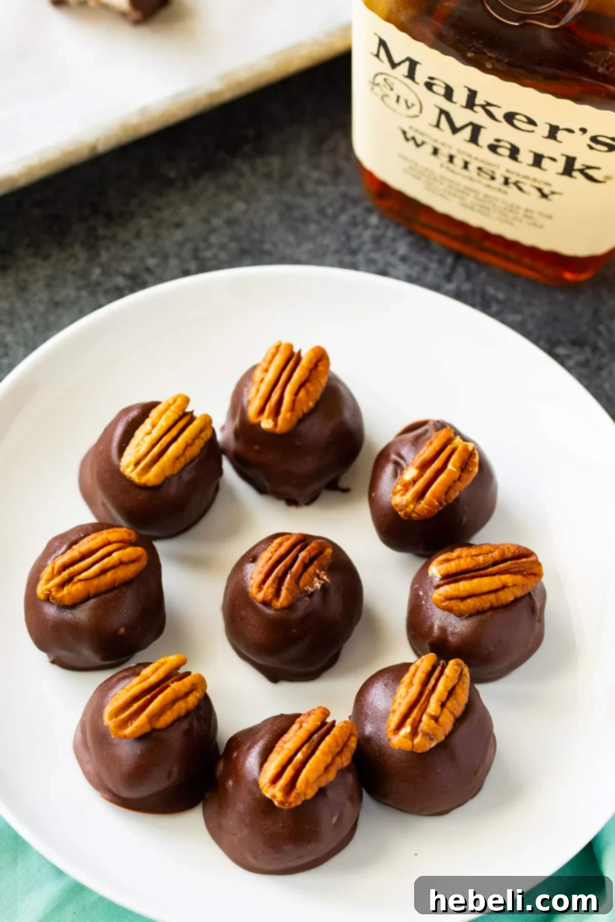 Nine Bourbon Balls arranged neatly on a plate, ready to be served.