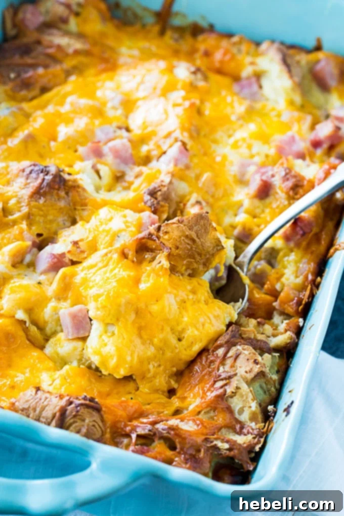 Savory Croissant Ham and Cheese Bake 4 Close-up of baked Ham and Cheese Croissant Casserole with melted cheese
