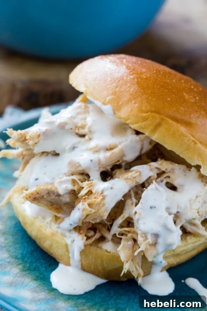Slow Cooker Alabama White Pulled Chicken 5 Slow Cooker Pulled Chicken with Alabama White BBQ Sauce in a serving bowl