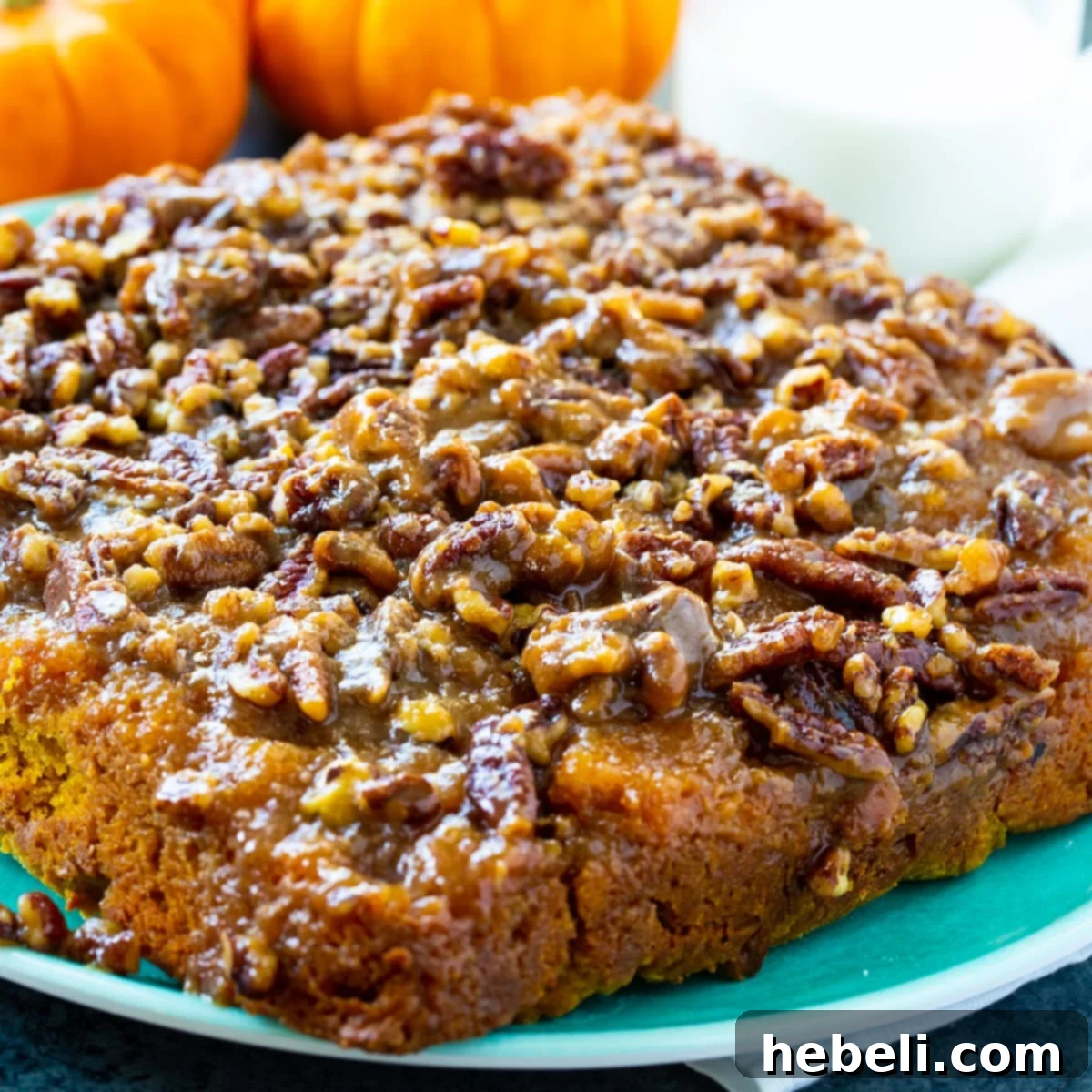 Caramel Pecan Pumpkin Pull-Aparts on a serving plate, showcasing the gooey caramel and pecan topping.