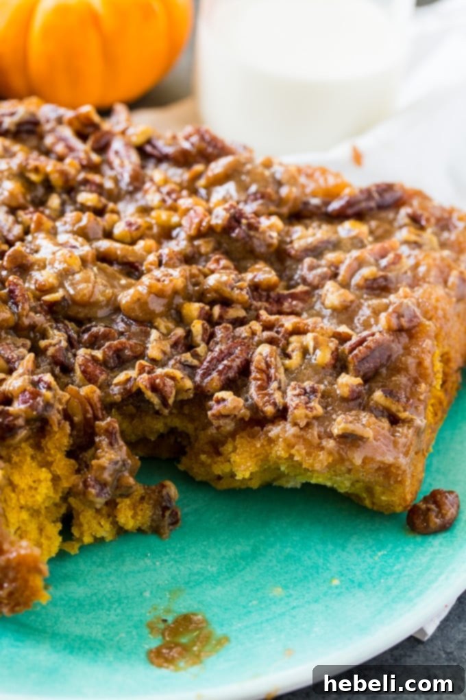 Unbaked Caramel Pecan Pumpkin Pull-Aparts in a baking dish, showing the dough squares ready for rising and baking.