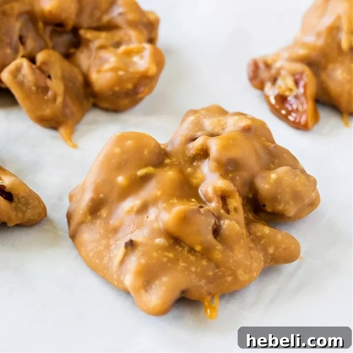 Delicious Microwave Pecan Pralines cooling on parchment paper, ready to be enjoyed.
