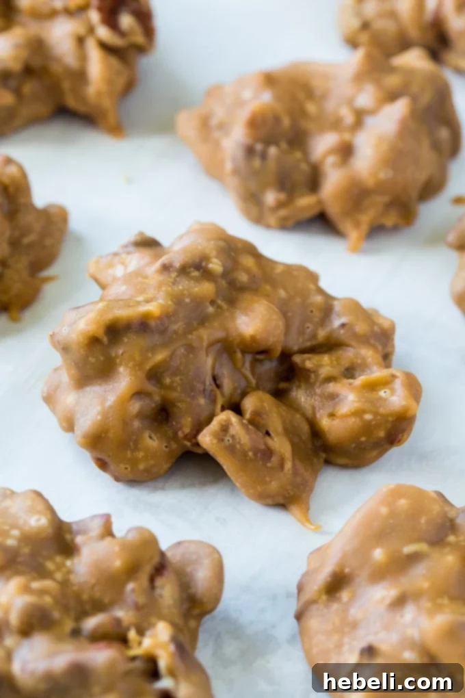 A batch of Microwave Pralines cooling on parchment paper, perfect for gifting or a sweet snack.