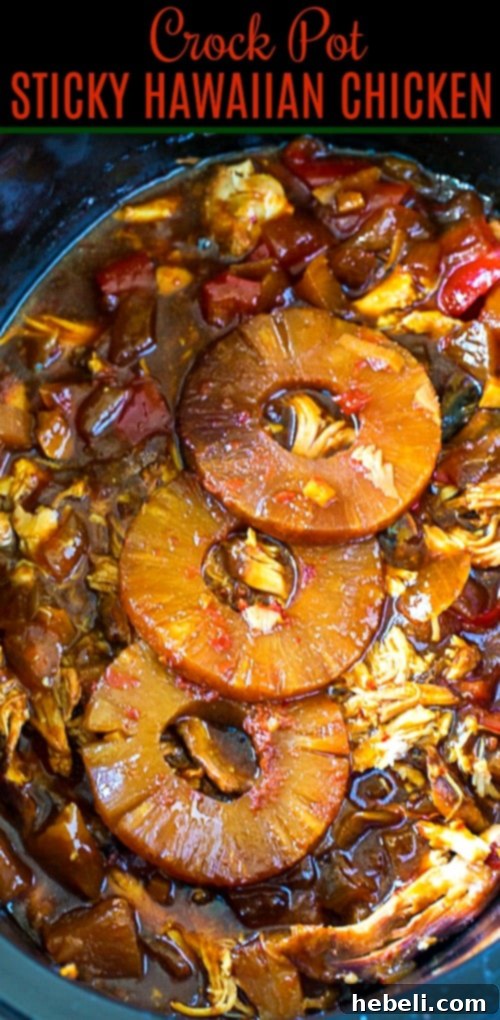 Tropical Sticky Slow Cooker Chicken 7 Hawaiian Sticky Chicken simmering in a slow cooker, showcasing the rich sauce.