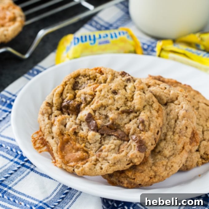 Butterfinger Cookies - perfectly golden brown cookies with visible Butterfinger pieces