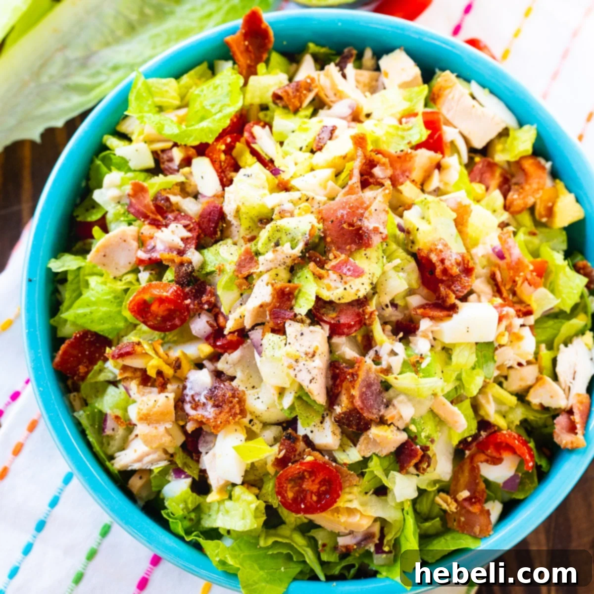 Chopped Cobb Salad in a bright blue bowl.