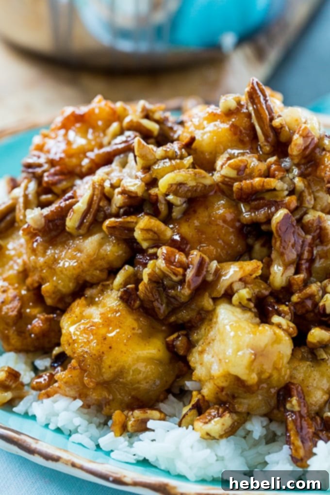 Honey Glazed Pecan Chicken 4 Chicken pieces marinating in buttermilk and being coated in seasoned flour.
