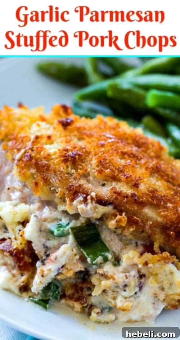 Close-up of a Garlic Parmesan Stuffed Pork Chop cut open, showing the creamy filling.
