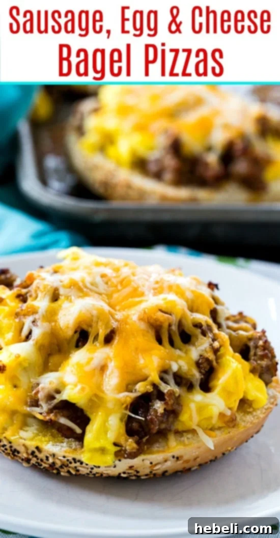 Two halves of a Sausage, Egg & Cheese Bagel Pizza on a wooden cutting board, garnished with fresh chives, ready to be enjoyed