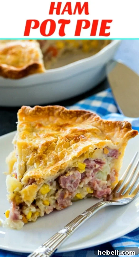 Ham Pot Pie baked in a deep dish pie pan, with a view of the golden, crimped edges
