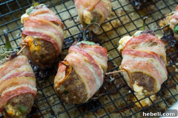 Baked Armadillo Eggs on a baking rack.
