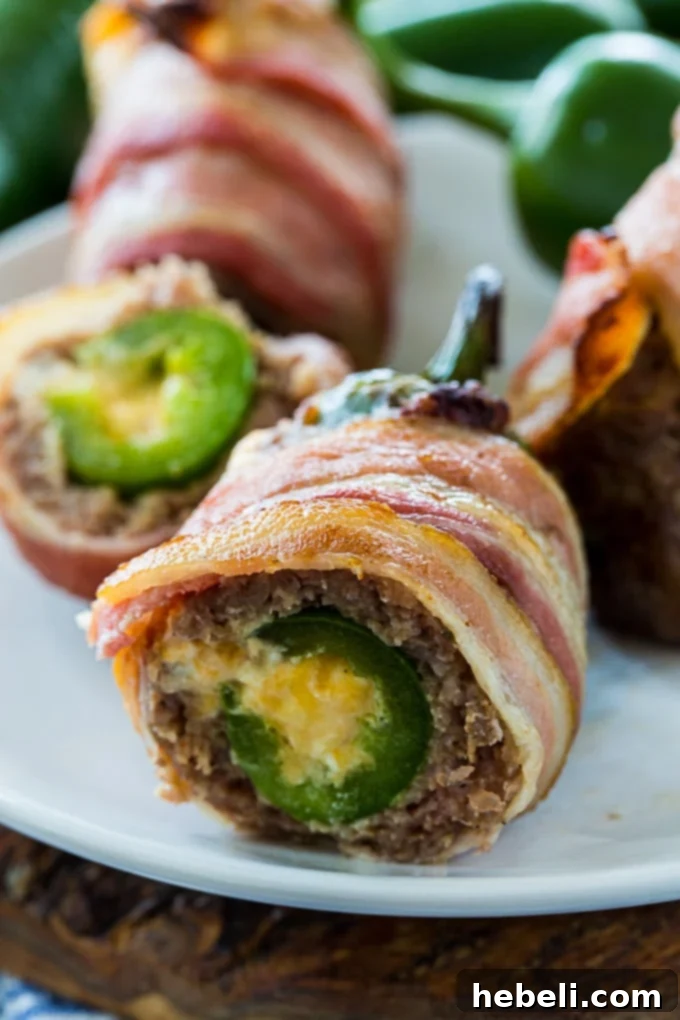 Armadillo Eggs wrapped in bacon.