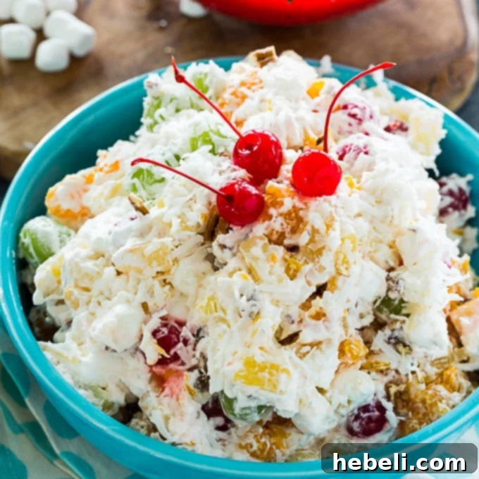 Sweet Southern Ambrosia Delight 2 A vibrant bowl of Southern Ambrosia Salad, showcasing its creamy texture and colorful fruits, perfect for holiday gatherings