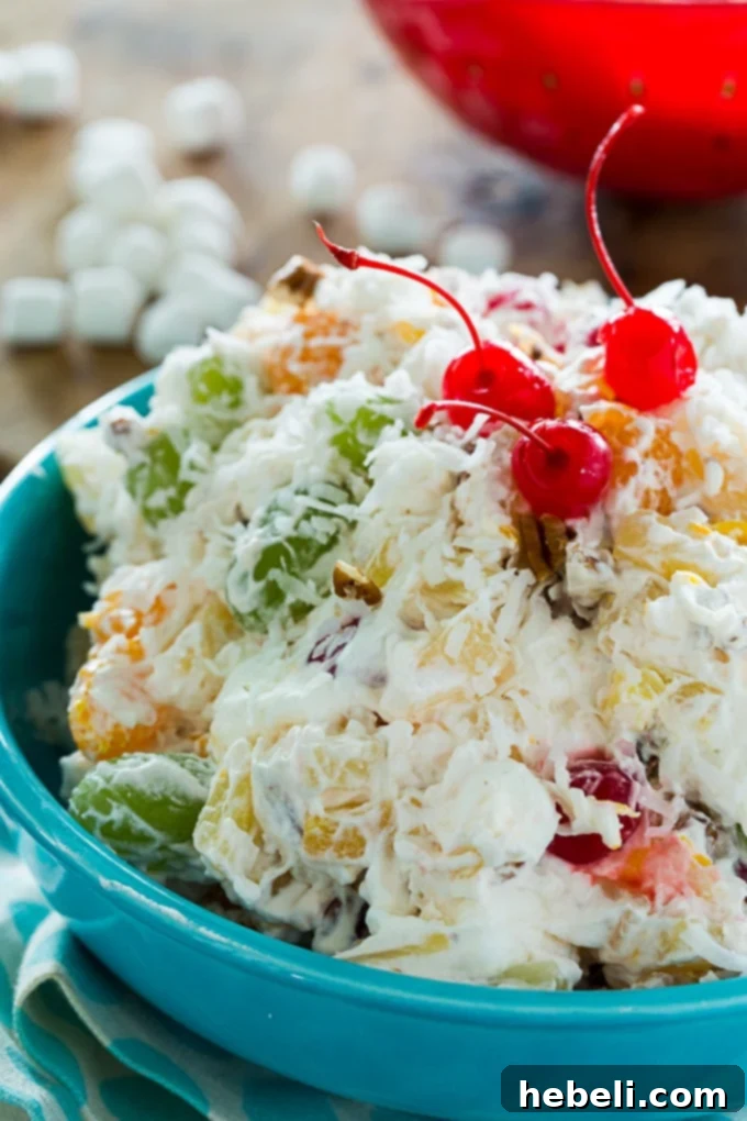 Sweet Southern Ambrosia Delight 4 A large serving bowl filled with ready-to-eat Southern Ambrosia Salad, garnished for presentation