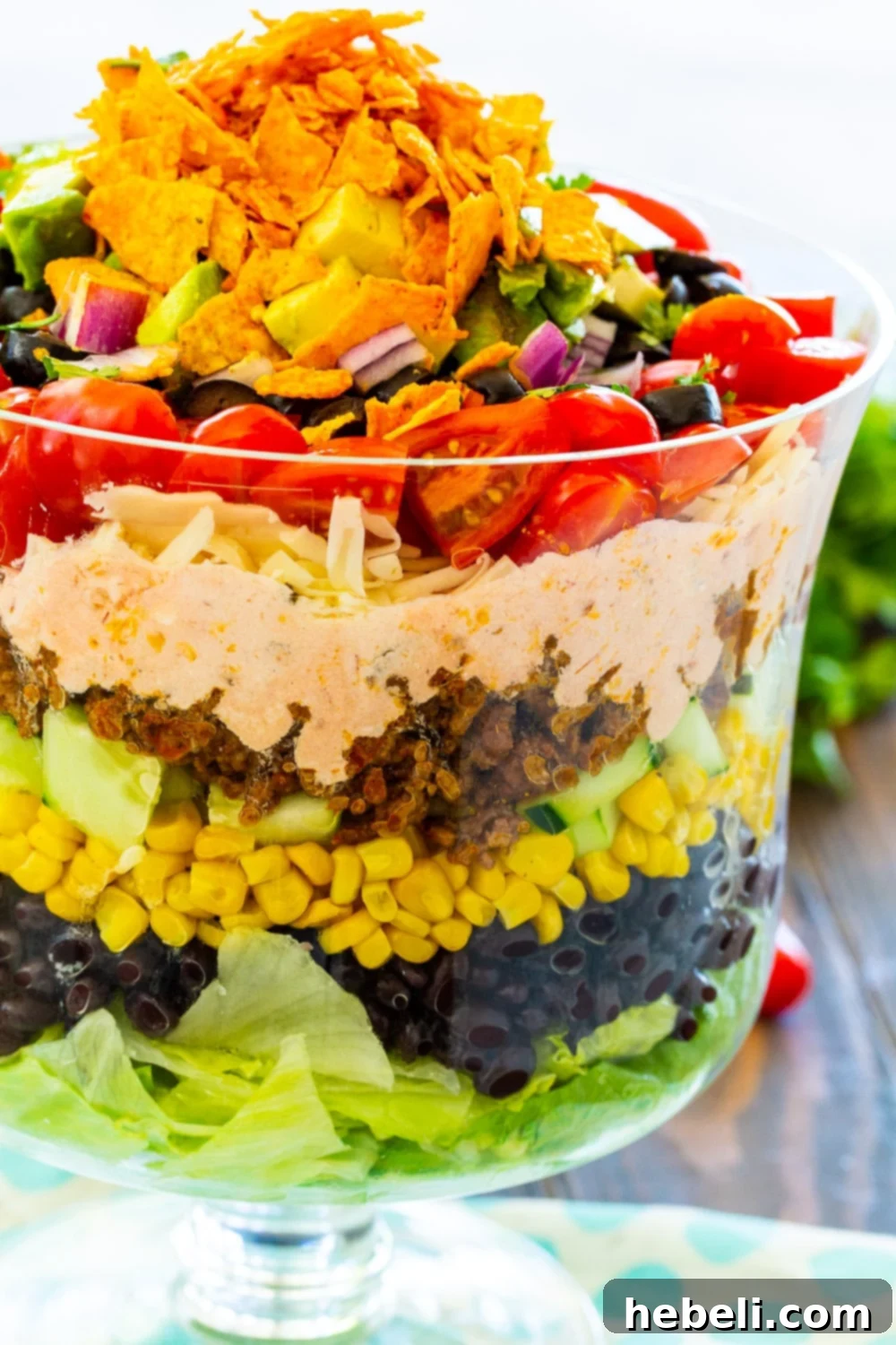 Stacked Taco Salad 5 An appetizing close-up of Layered Taco Salad, highlighting the creamy salsa dressing and fresh toppings.