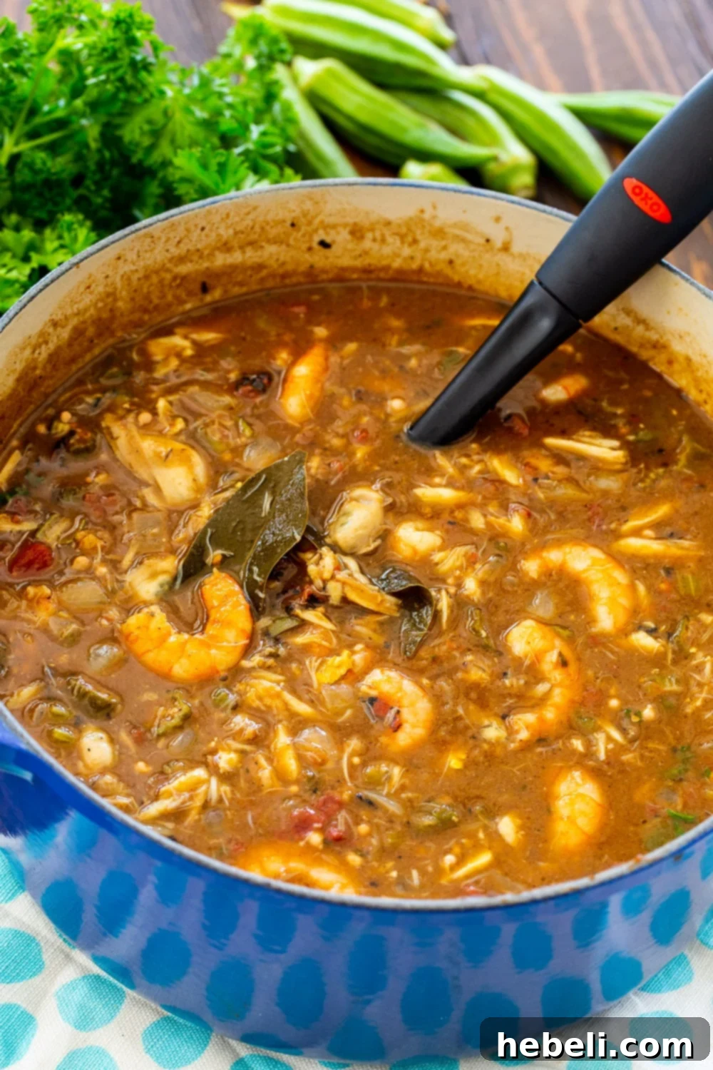 Southern Seafood and Okra Gumbo 3 A large pot brimming with rich, dark seafood gumbo, ready to be served.