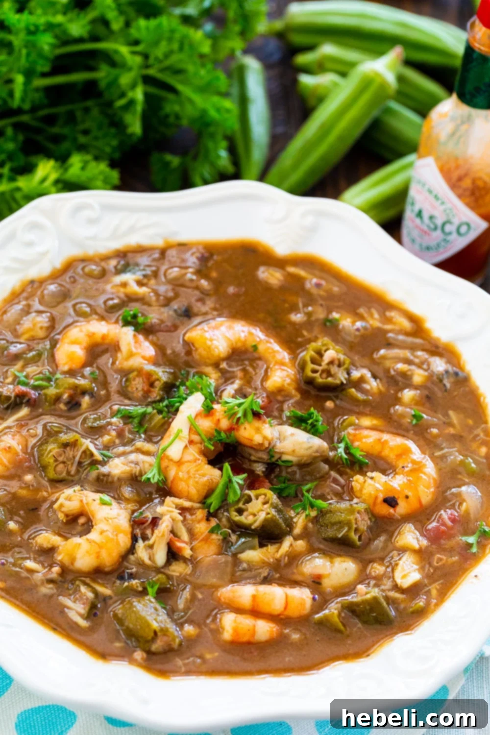 Southern Seafood and Okra Gumbo 4 A close-up shot of a rich and spicy bowl of Seafood and Okra Gumbo, garnished and ready to eat.