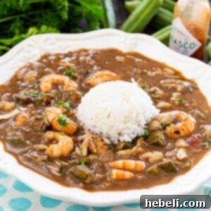 Southern Seafood and Okra Gumbo 5 Seafood and Okra Gumbo with rice, garnished with fresh herbs