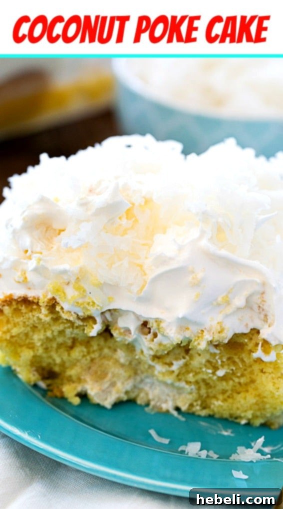 A stunning full view of the Coconut Cream Poke Cake, beautifully garnished with shredded coconut, ready to be served.