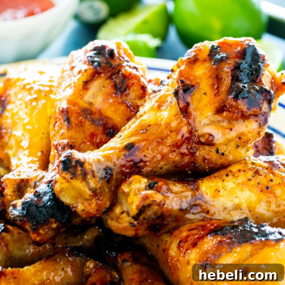 Zesty Jalapeno Lime Chicken Drumsticks 2 Pile of succulent Jalapeno Lime Chicken Drumsticks ready to serve on a rustic plate.