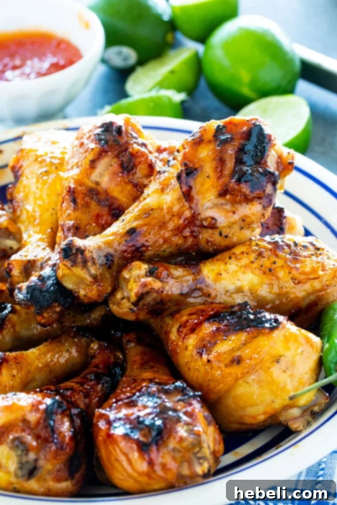 Zesty Jalapeno Lime Chicken Drumsticks 3 Close-up of perfectly grilled Jalapeno Lime Chicken Drumsticks on the grill grates.