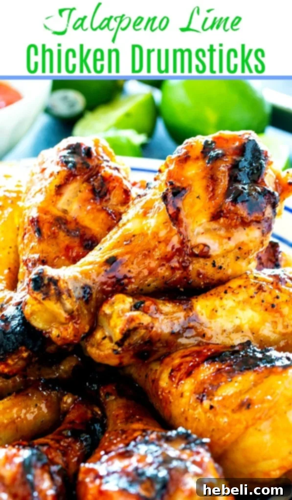 Zesty Jalapeno Lime Chicken Drumsticks 5 Close-up of a single succulent Jalapeno Lime Chicken Drumstick on a bed of greens.