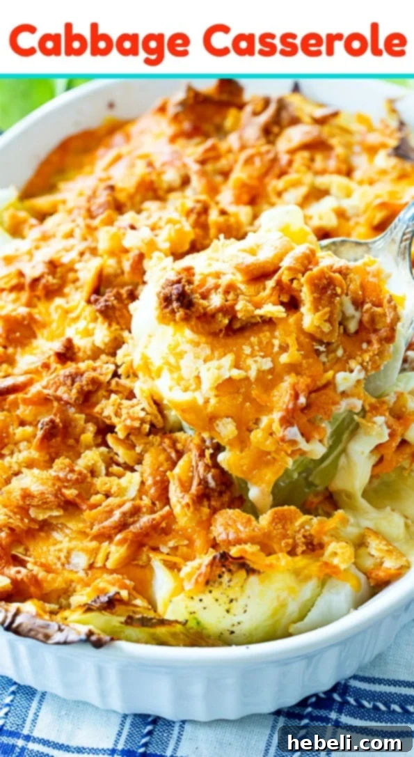 Close-up of Old-Fashioned Cabbage Casserole topped with golden crushed crackers and melted cheddar cheese.