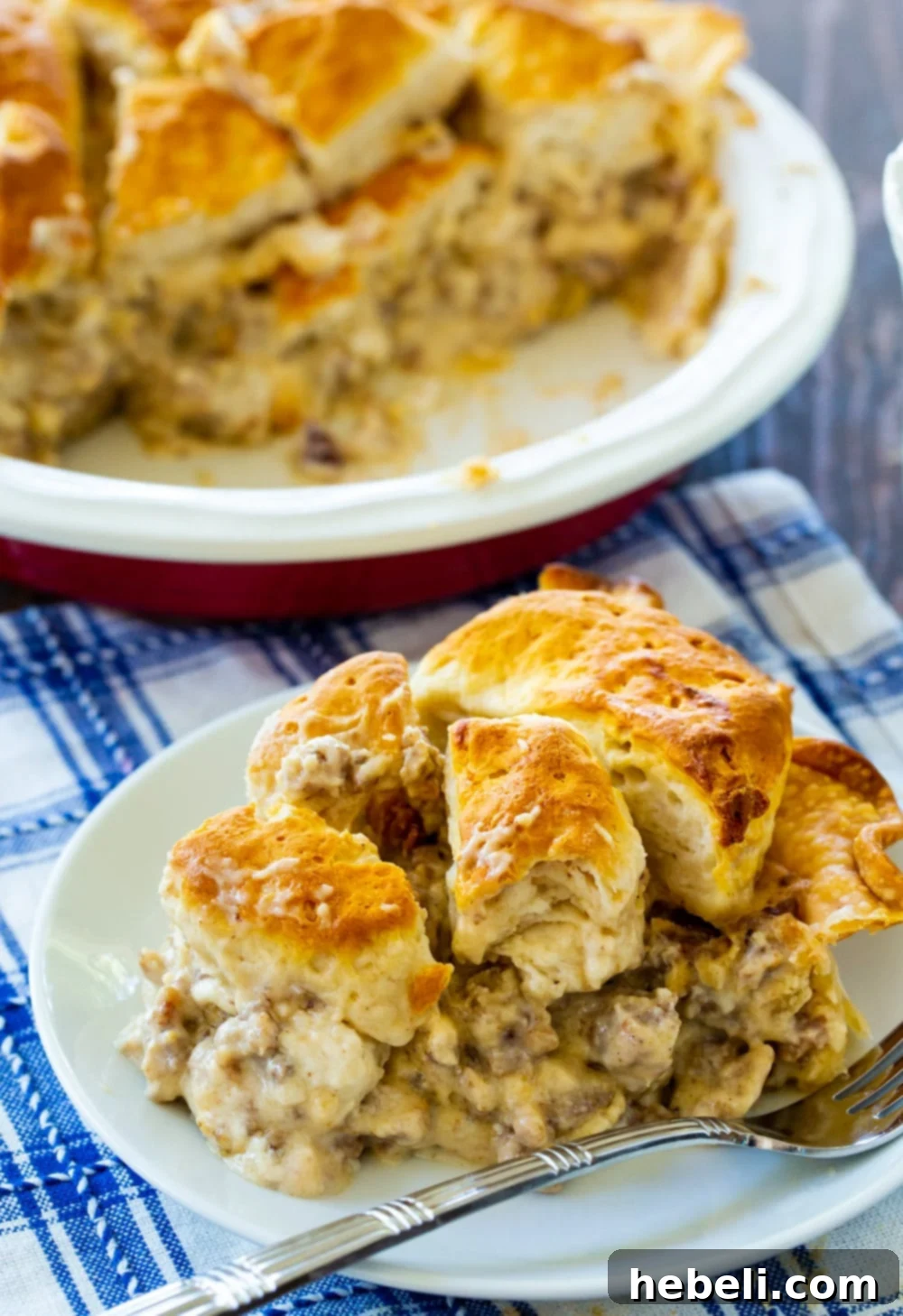 Homestyle Gravy & Biscuit Pie 3 A mouth-watering image of the entire Biscuits and Gravy Pie, still in the pie pan, showcasing its golden-brown biscuit top and rich interior.
