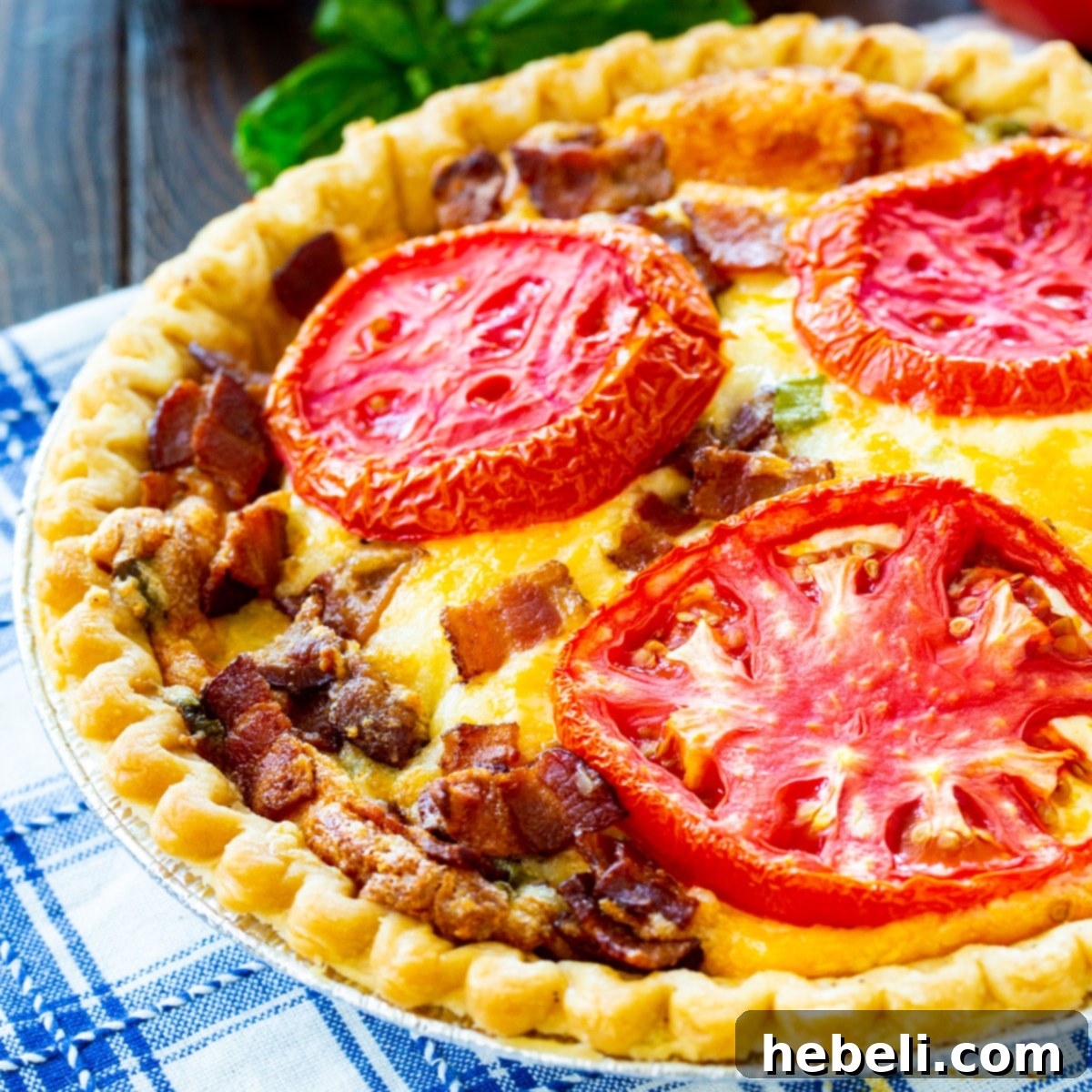 Whole Tomato Pie with Bacon, showcasing a golden-brown crust and a rich, cheesy tomato filling, presented in a rustic pie pan.