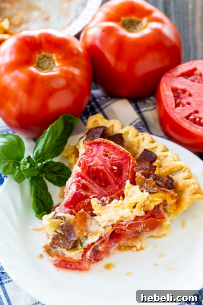 Close-up of freshly sliced tomatoes, salted and ready for blotting, an essential step for preventing a soggy tomato pie.