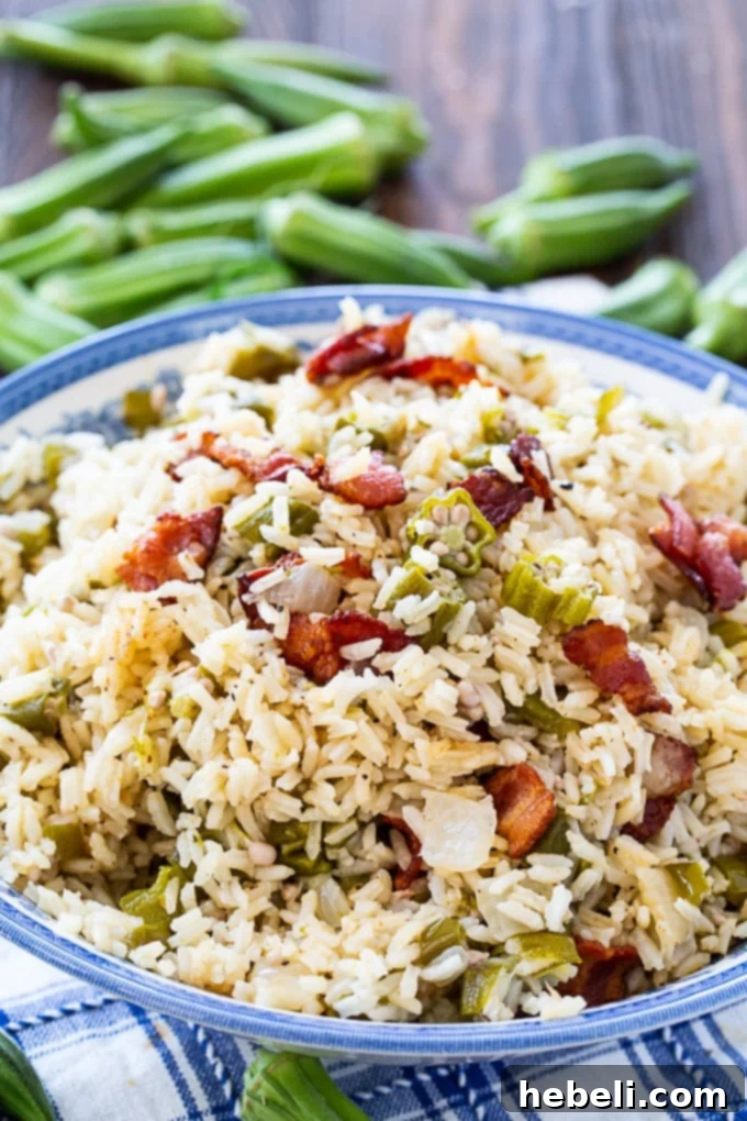 A bowl of Okra Pilau, featuring perfectly cooked rice and tender okra, ready to be enjoyed.
