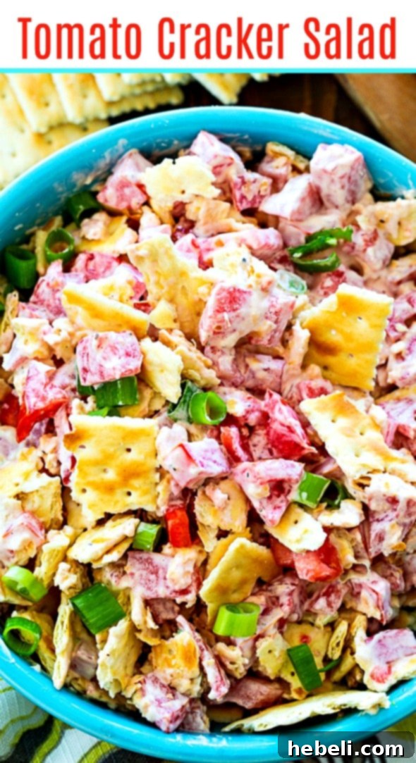 Tomato Cracker Salad with fresh tomatoes and herbs in the background