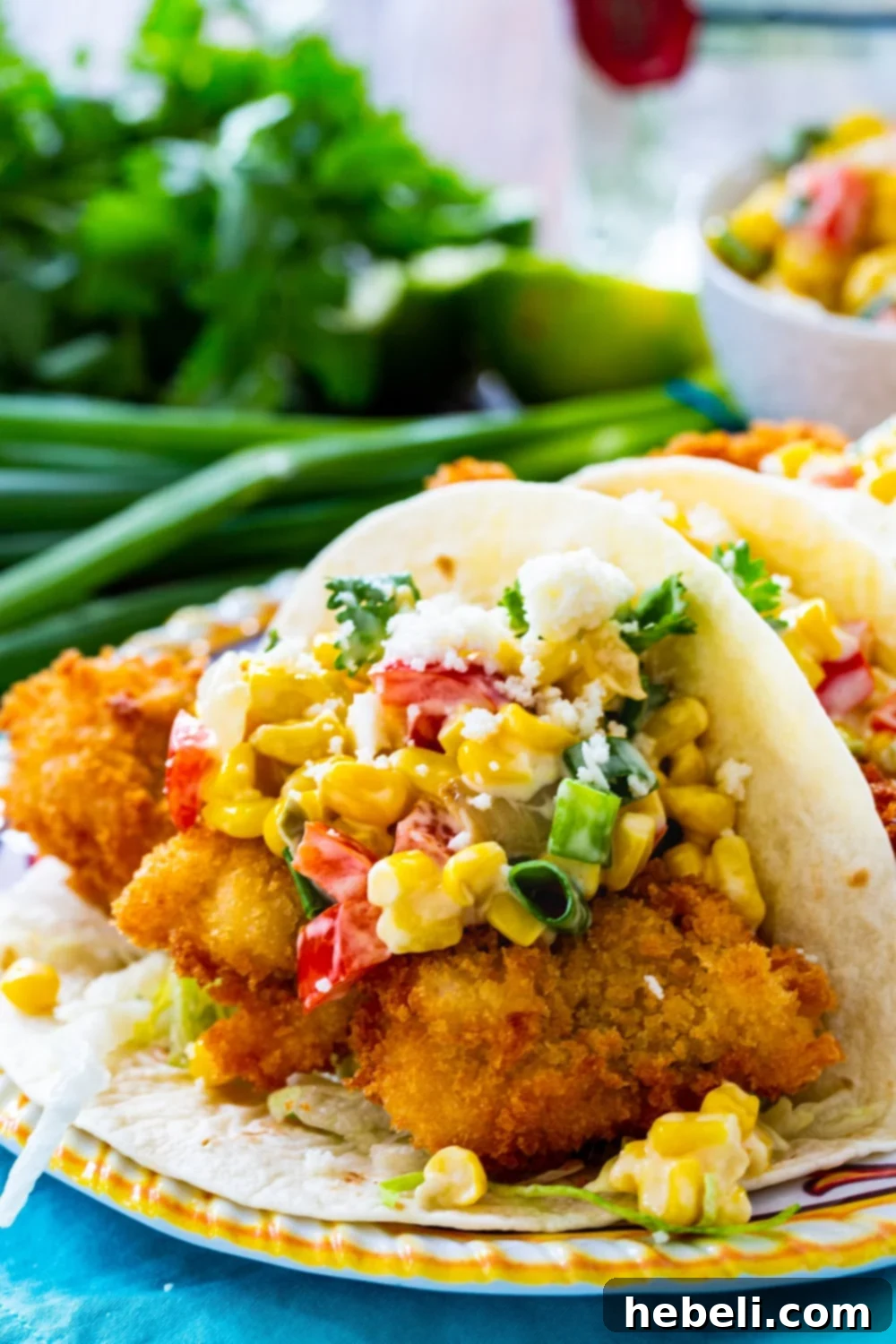 Crispy Catfish Tacos with Tequila Spiked Creamed Corn 4 Close-up of Crunchy Catfish Tacos with Tequila Creamed Corn, showing the crispy fish and creamy texture.