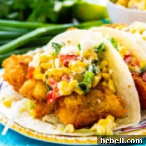 Crispy Catfish Tacos with Tequila Spiked Creamed Corn 5 Crunchy Catfish Tacos on a plate, ready to eat.