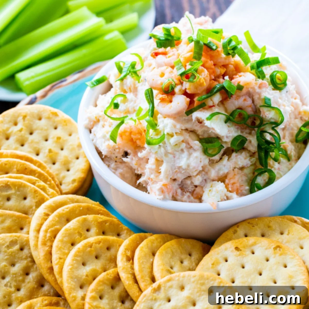 Easy Shrimp Spread in a bowl surrounded by crackers, highlighting its creamy texture.