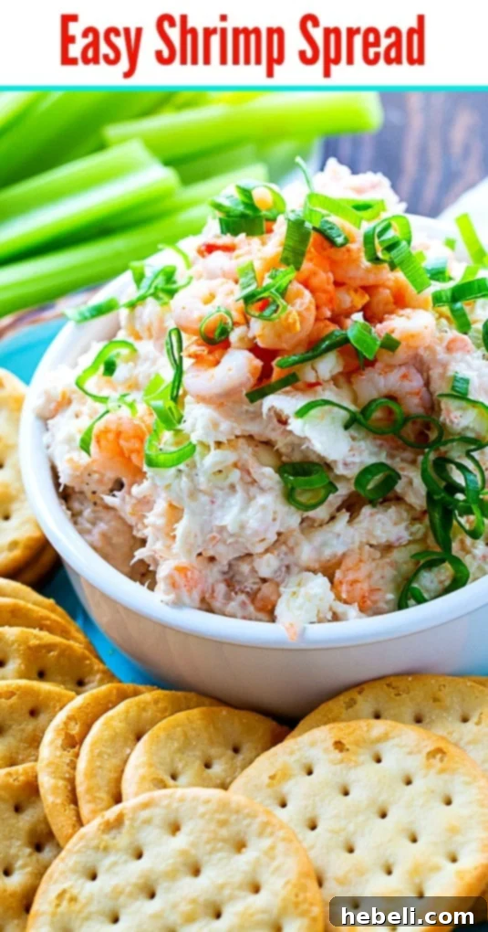 Easy Shrimp Spread beautifully presented with a variety of crackers, perfect for any social gathering.