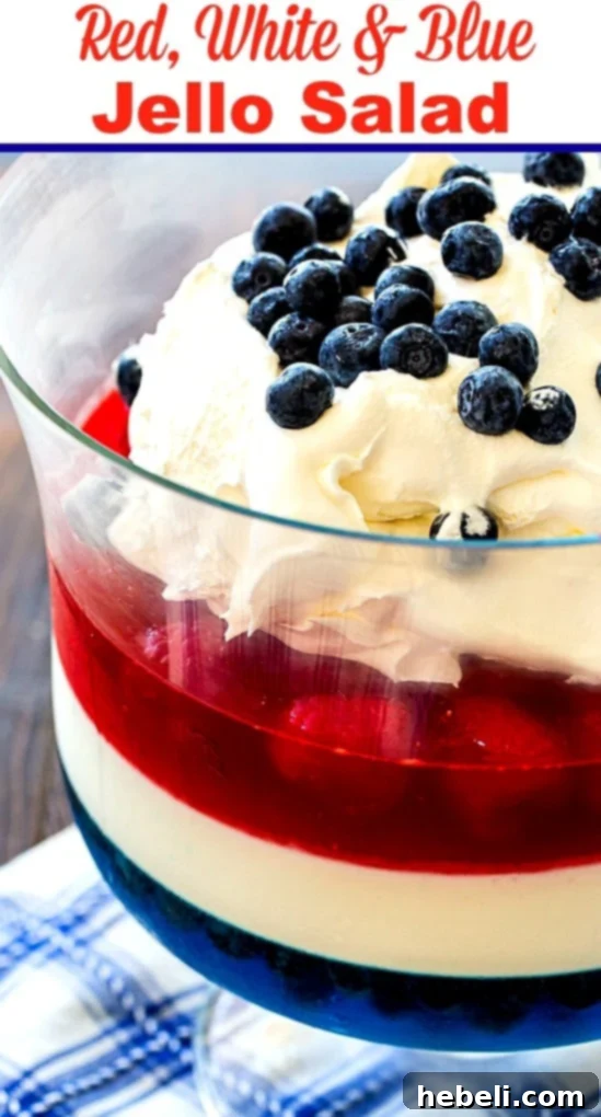 Festive Red White and Blue Jello 5 The Red, White & Blue Jello Salad showcasing its distinct and colorful layers in a trifle dish.