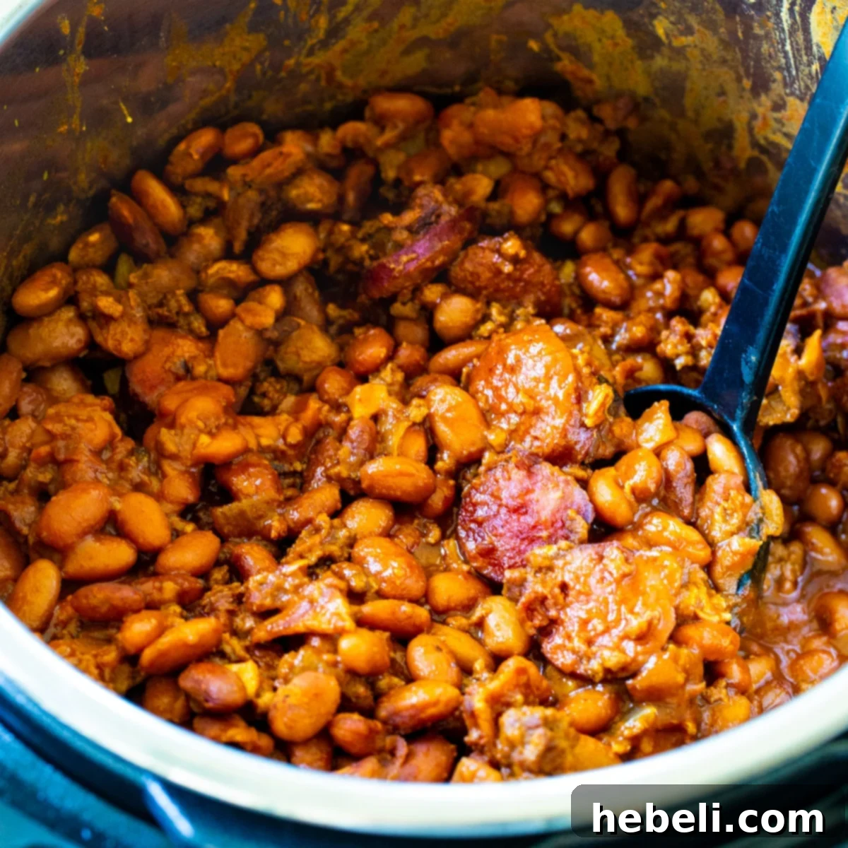 Robust Instant Pot Chuck Wagon Beans 2 Instant Pot Cowboy Beans in Instant Pot with spoon.
