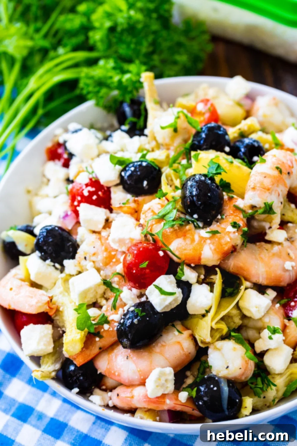 Zesty Italian Marinated Shrimp 3 Italian Marinated Shrimp garnished with fresh parsley in a large serving bowl.